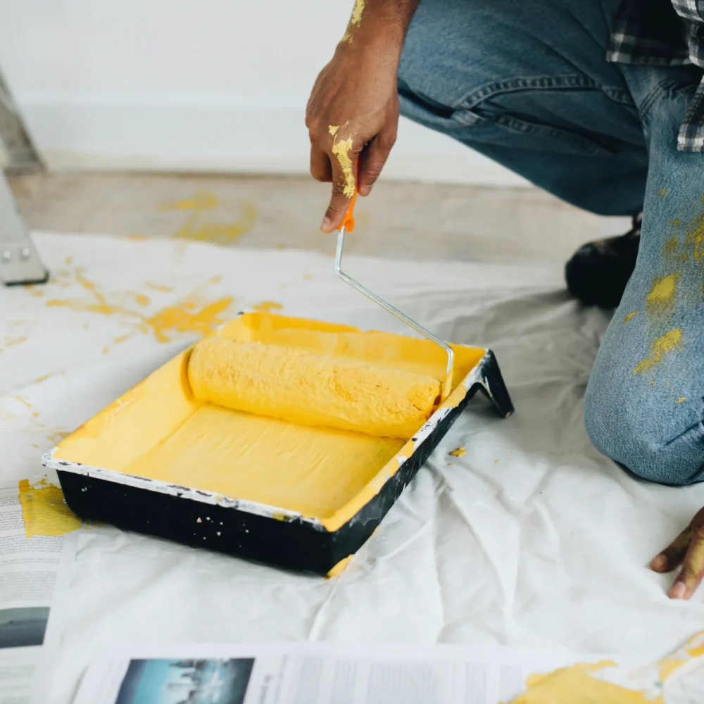 man-painting-walls-yellow (1)