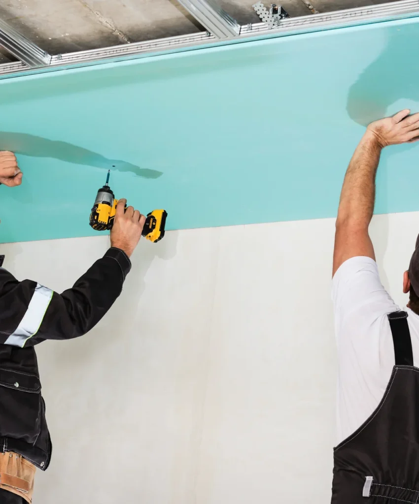 plasterboard-installers-men-assembling-drywall-false-ceiling-simple-affordable-renovation-premises (1) (1)