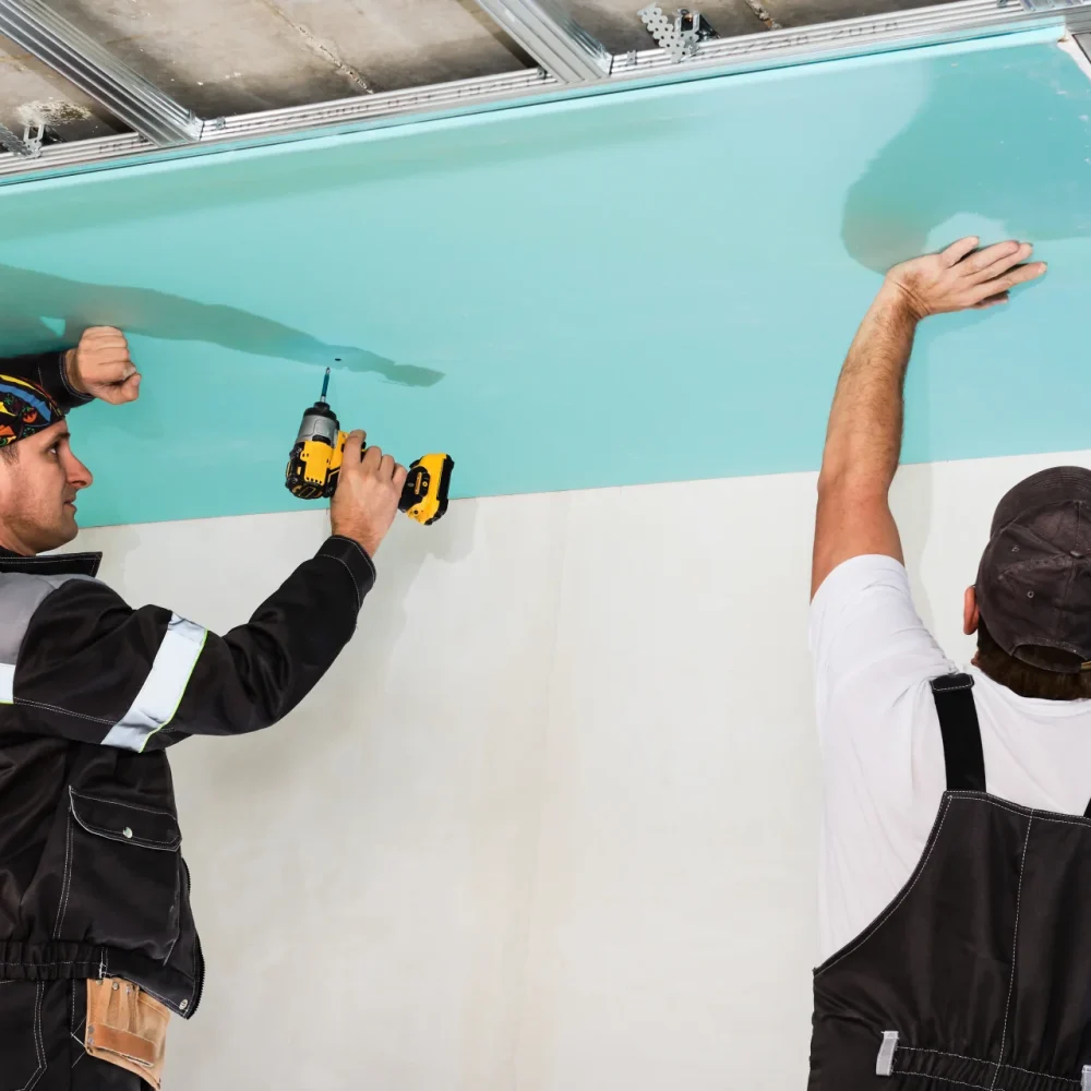 plasterboard-installers-men-assembling-drywall-false-ceiling-simple-affordable-renovation-premises (1) (1)